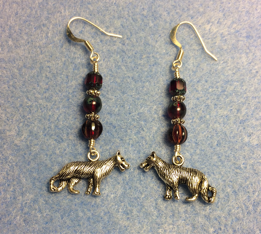Silver wolf charm earrings adorned with dark red Czech glass beads