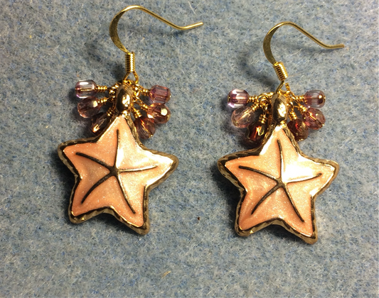 Large peach enamel starfish charm earrings adorned with small dangling peach and pink Czech glass beads.