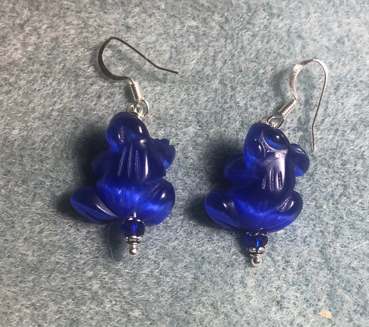 Dark blue fiber optic (cat’s eye) frog bead earrings adorned with dark blue Chinese crystal beads.