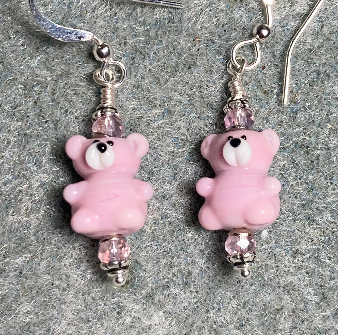 Small pink lamp work teddy bear bead earrings adorned with pink Chinese crystal beads.