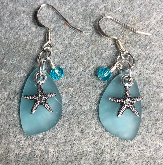 Small light turquoise sea glass pendant bead earrings adorned with small silver starfish charms and small light turquoise Chinese crystal beads.