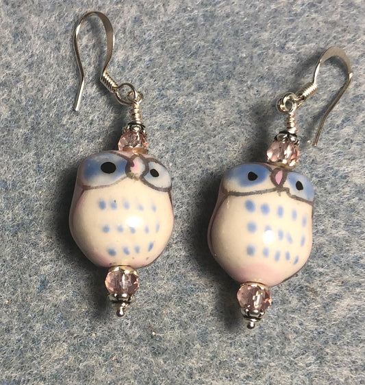Light pink and blue ceramic spotted owl bead earrings adorned with light pink Chinese crystal beads.