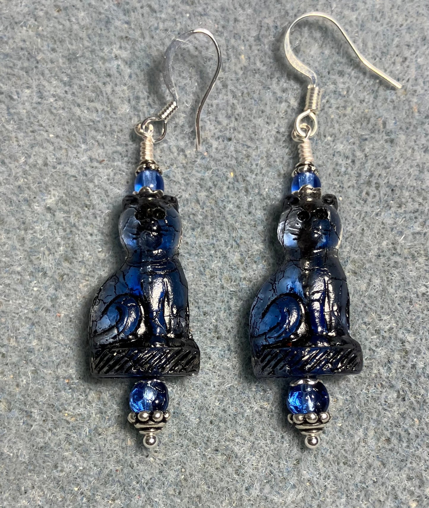 Dark blue (with black inlay) fancy Czech glass cat bead earrings adorned with dark blue Czech glass beads.