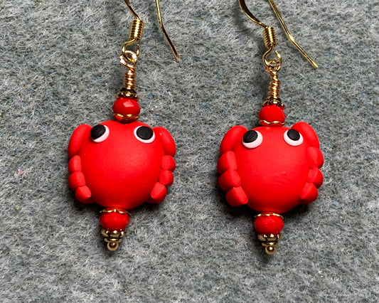 Red polymer clay crab bead earrings adorned with red Chinese crystal beads.