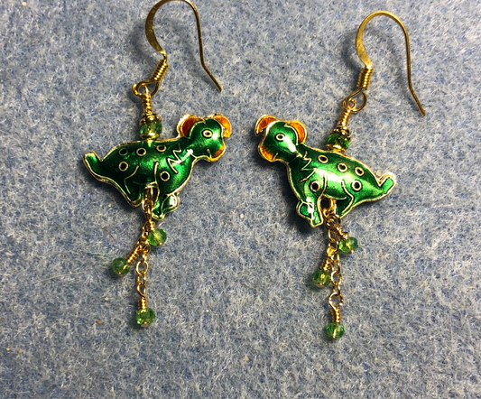 Green and white vintage cloisonné dog bead earrings adorned with gold chain and tiny green Chinese crystal beads.