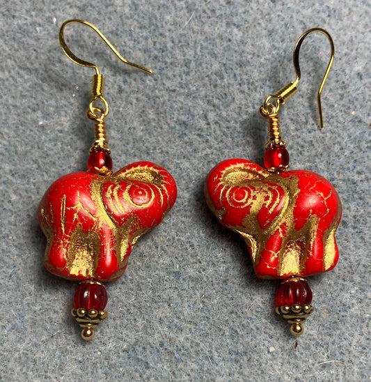 Bright red (with gold inlay) Czech glass elephant bead earrings adorned with red Czech glass beads.