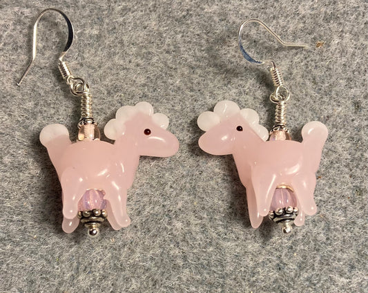 Opaque pink lamp work spotted horse bead earrings adorned with pink Czech glass beads.
