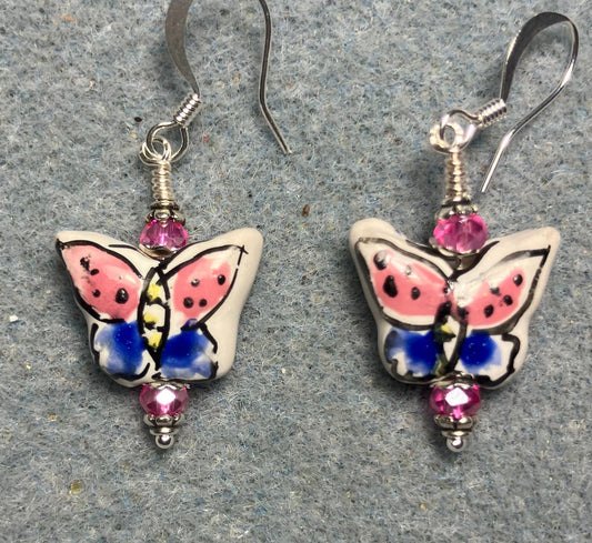 Hot pink and blue ceramic butterfly bead earrings adorned with hot pink Chinese crystal beads.