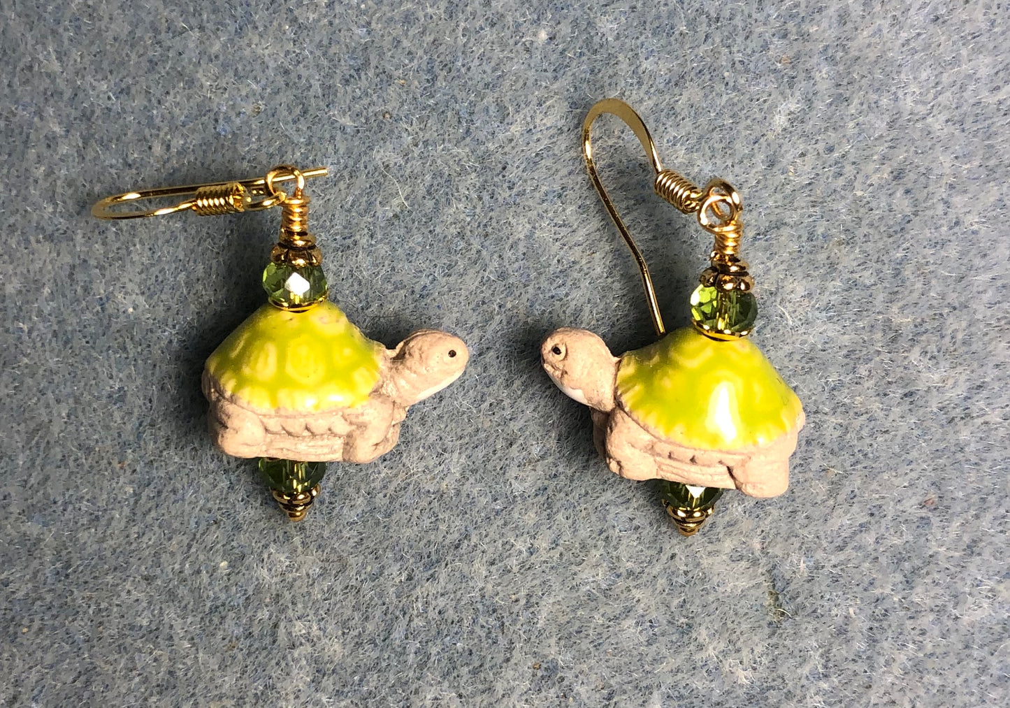 Small tan and lime green ceramic turtle bead earrings adorned with lime green Chinese crystal beads.