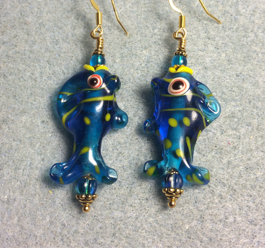 Turquoise and yellow lamp work fish bead earrings adorned with turquoise Czech glass beads.