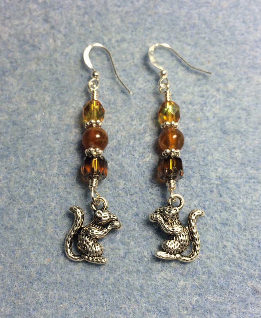 Silver squirrel charm earrings adorned with amber Czech glass beads