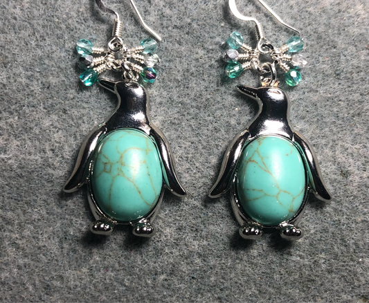 Large silver and light turquoise gemstone penguin charm earrings adorned with small dangling turquoise and silver Czech glass beads.