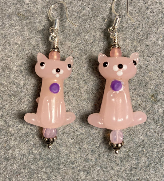 Pink lamp work cat bead earrings adorned with pink Czech glass beads.