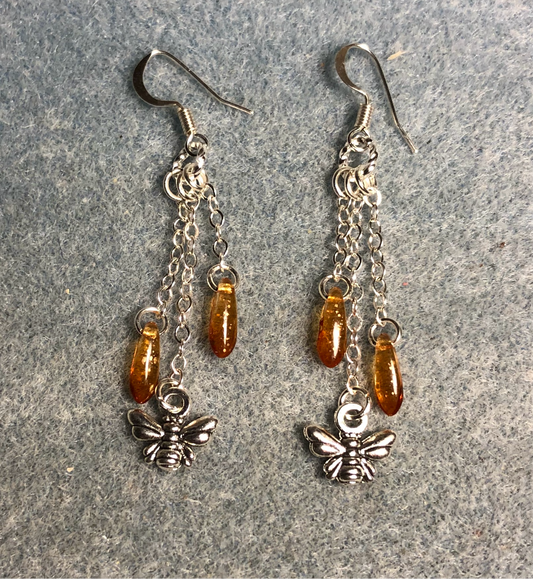 Small silver honeybee charm earrings attached to silver chain and adorned with small amber Czech glass dagger beads