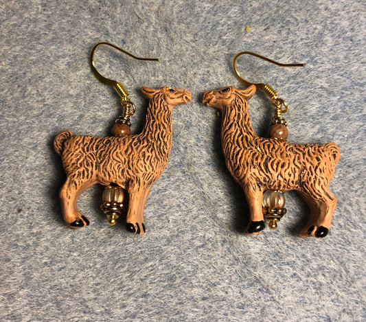 Large tan ceramic llama bead earrings adorned with tan Czech glass beads.