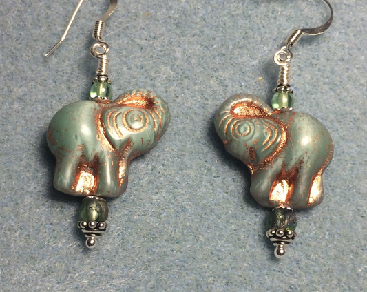 Light green (with copper inlay)Czech glass elephant bead earrings adorned with light green Czech glass beads.