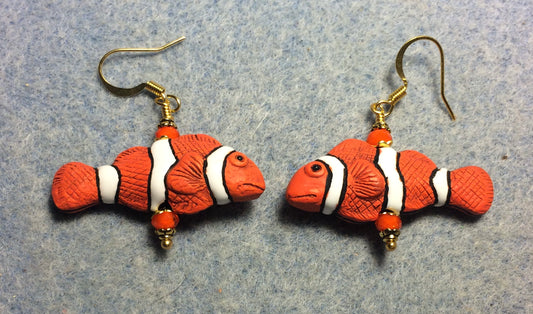 Orange, black, and white ceramic striped clownfish bead earrings adorned with orange Chinese crystal beads.