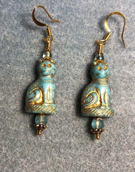 Opaque light turquoise (with gold inlay) fancy Czech glass cat bead earrings adorned with light turquoise Czech glass beads.