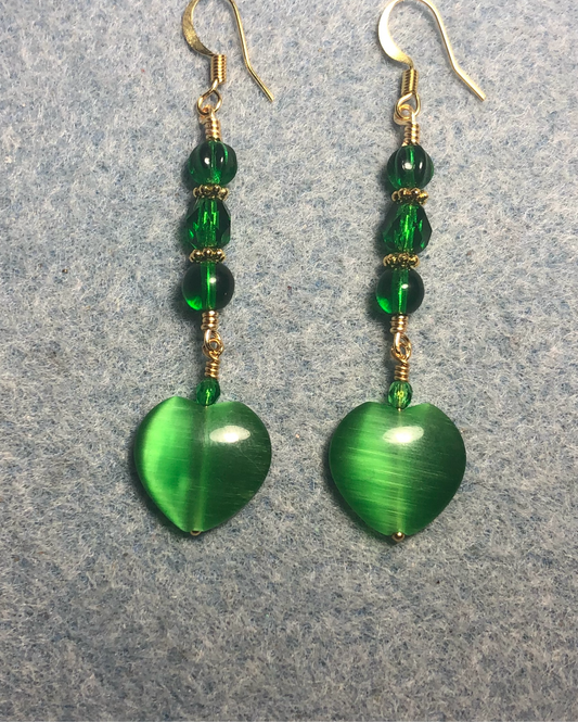 Emerald green fiber optic (cat’s eye) Czech glass heart bead earrings adorned with emerald green Czech glass beads.