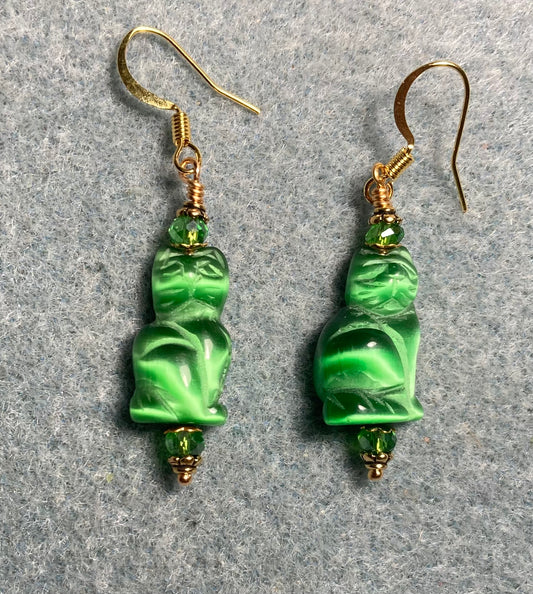 Emerald green fiber optic (cat’s eye) cat bead earrings adorned with emerald green Chinese crystal beads.