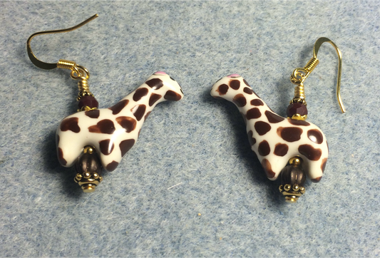 Brown and white ceramic spotted giraffe bead earrings adorned with brown Czech glass beads.