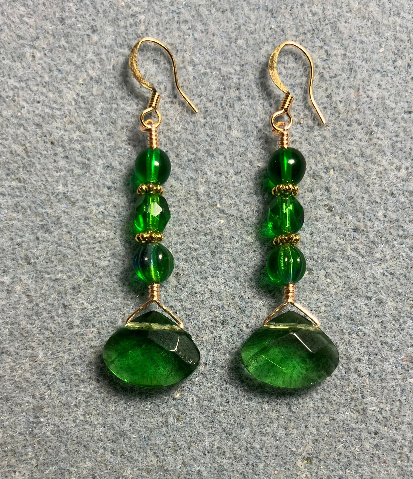 Emerald green Czech glass briolette bead earrings adorned with emerald green Czech glass beads.