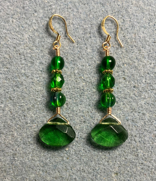 Emerald green Czech glass briolette bead earrings adorned with emerald green Czech glass beads.