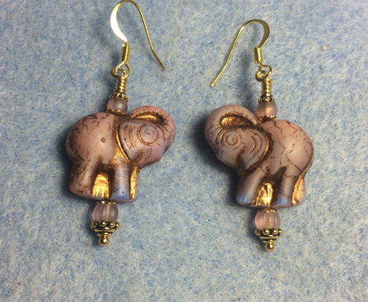 Pinkish purple (with gold inlay) Czech glass elephant bead earrings adorned with light purple Czech glass beads.