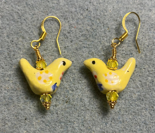 Small yellow, white, and blue ceramic bird bead earrings adorned with yellow Chinese crystal beads.