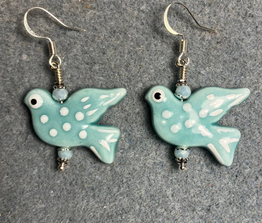 Large light turquoise and white ceramic spotted dove bead earrings adorned with light turquoise Chinese crystal beads.