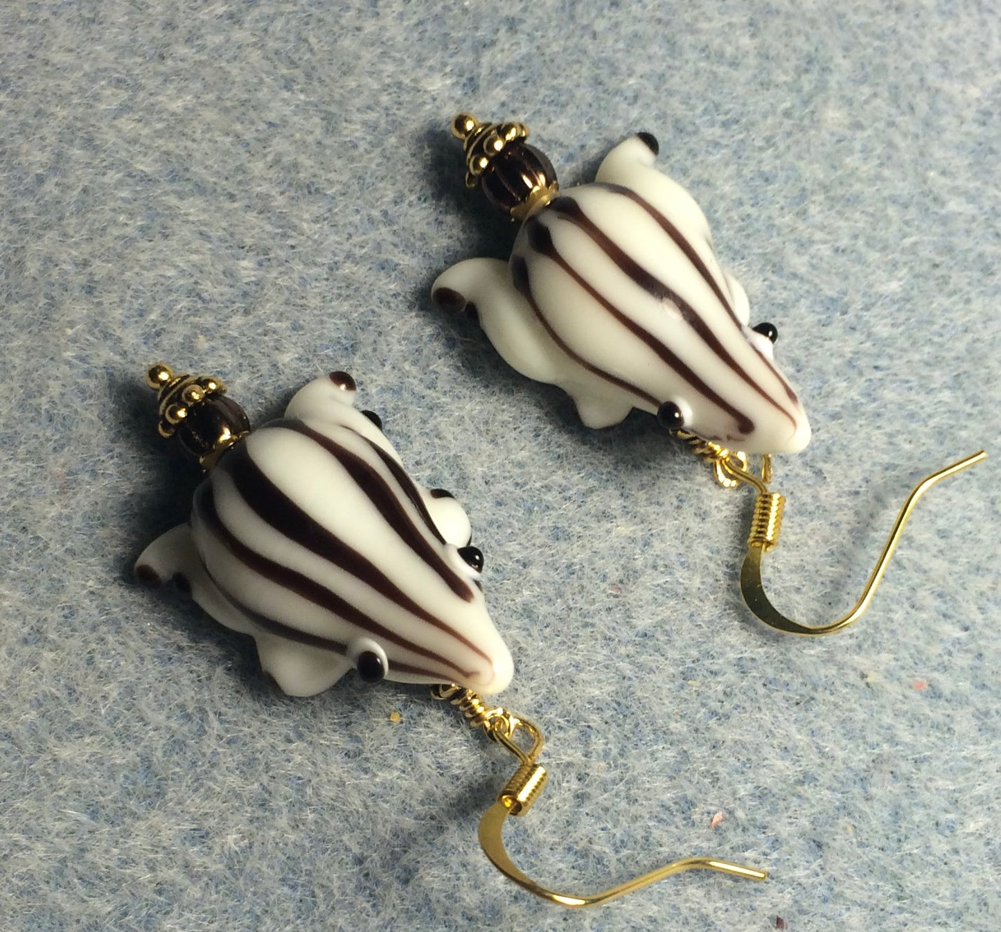 White with brown stripes lamp work frog bead earrings adorned with brown Czech glass beads.