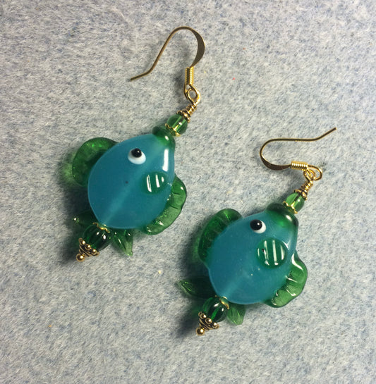 Turquoise and green lamp work fish bead earrings adorned with green Czech glass beads.