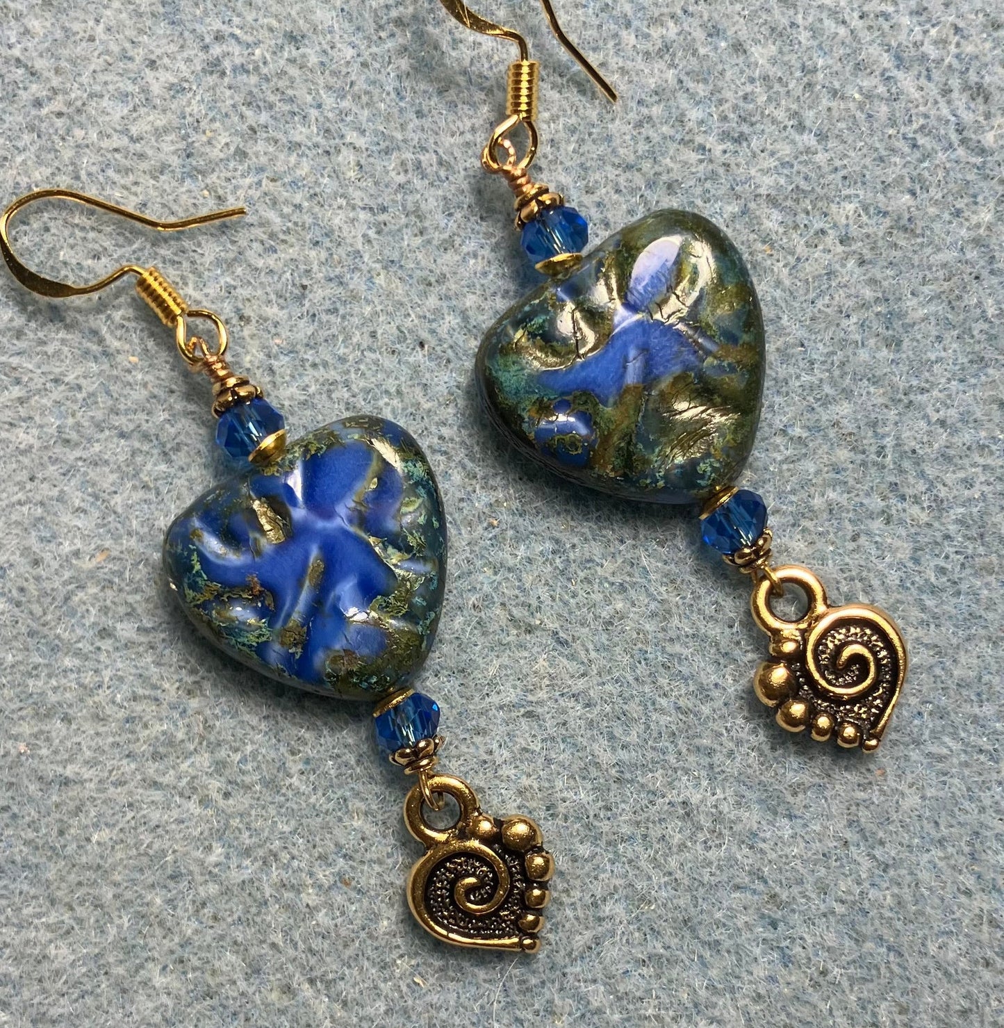 Dark blue Picasso Czech glass heart bead earrings made with dark blue Chinese crystal beads and gold Tierracast spiral heart charms.