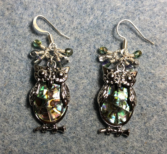 Large silver and abalone owl charm earrings adorned with small dangling light green and silver Czech glass beads.