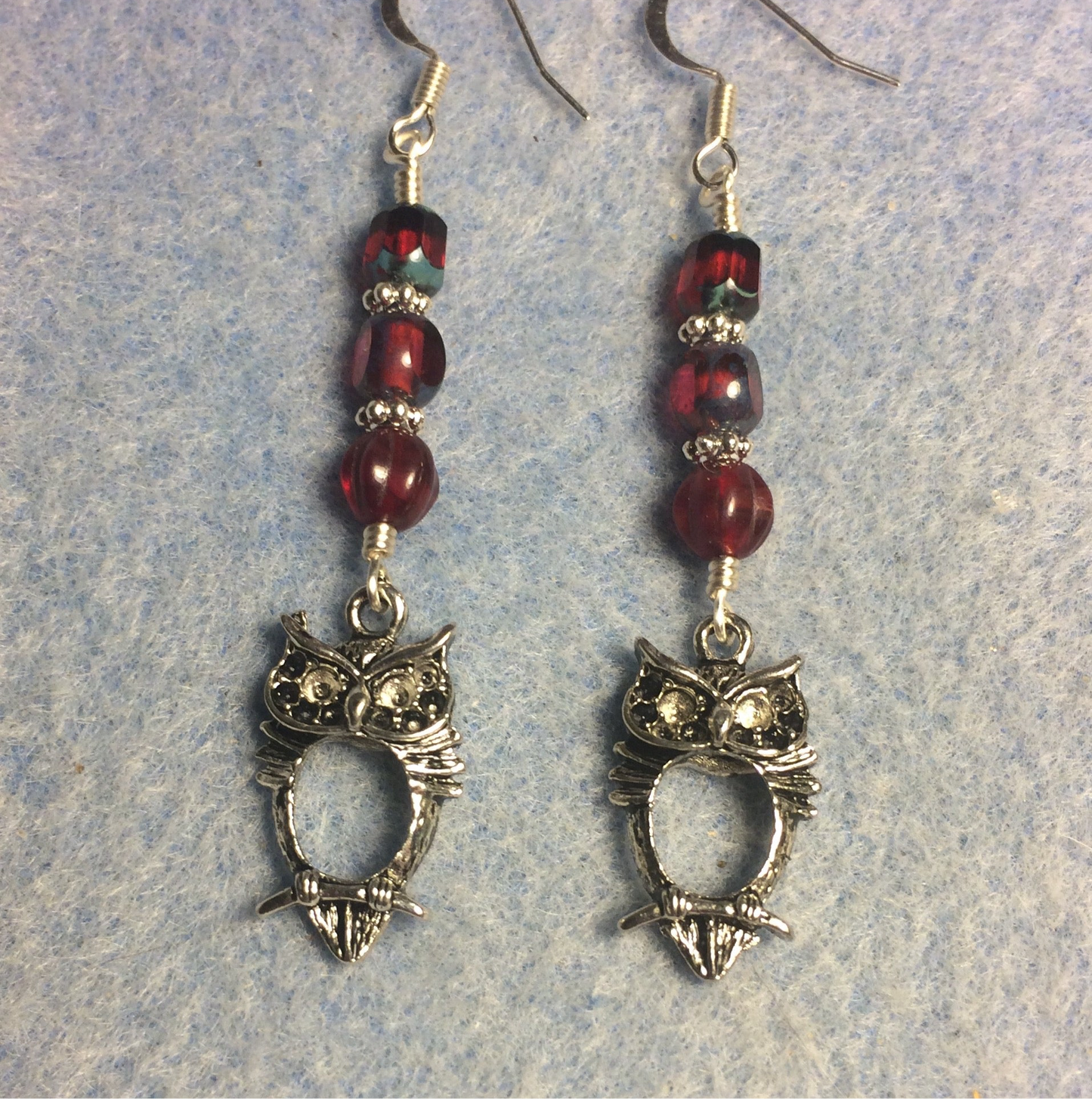 Silver owl charm earrings adorned with ruby red Czech glass beads