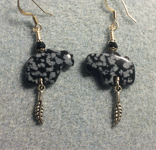 Snowflake obsidian gemstone buffalo fetish bead earrings adorned with black crystal beads and tiny silver feather charms.
