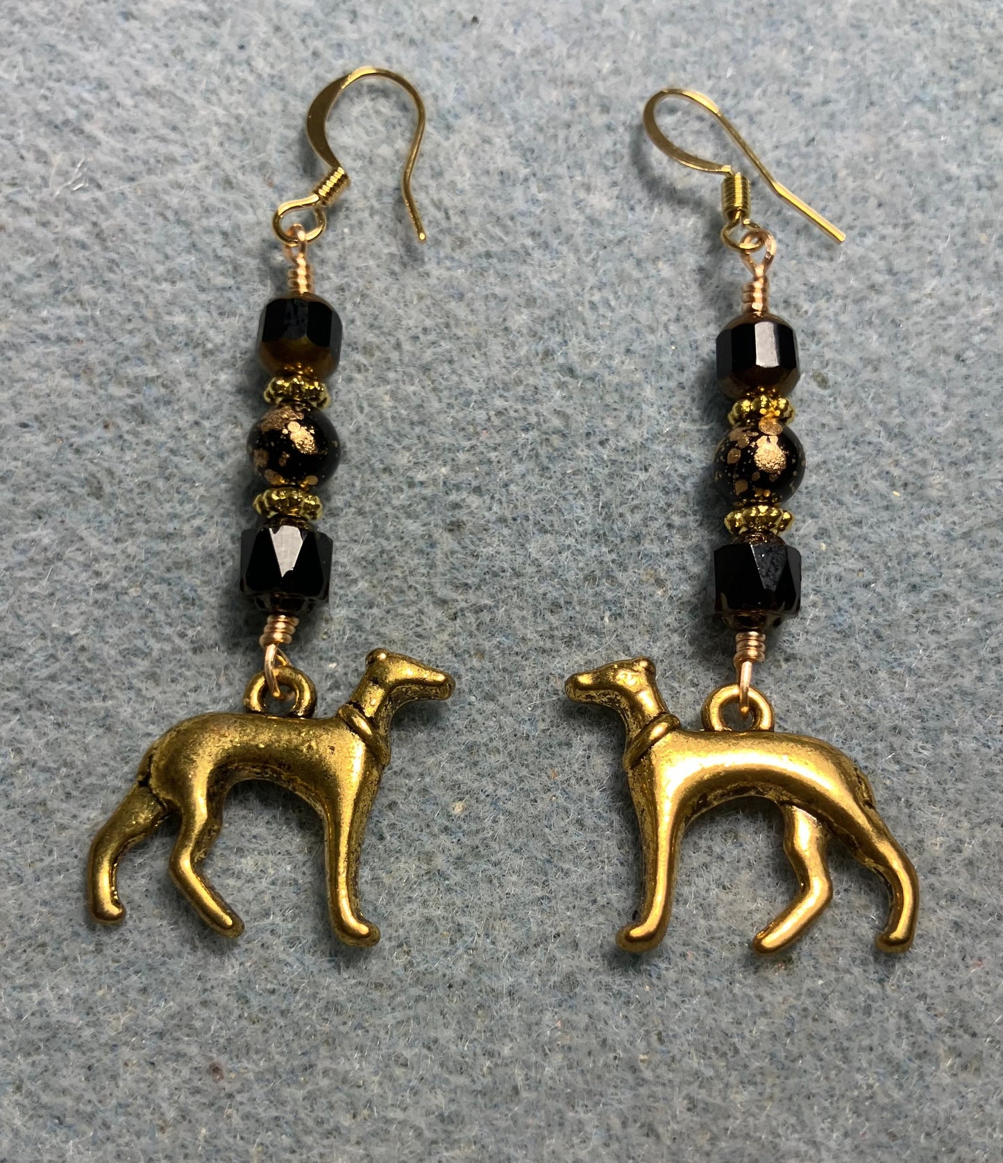 Gold greyhound charm earrings adorned with black Czech glass beads