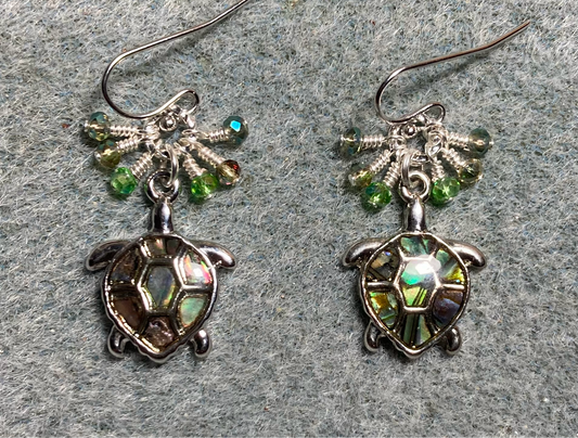 Silver and abalone sea turtle charm earrings adorned with tiny dangling light green, green, and sparkly green Chinese crystal beads.