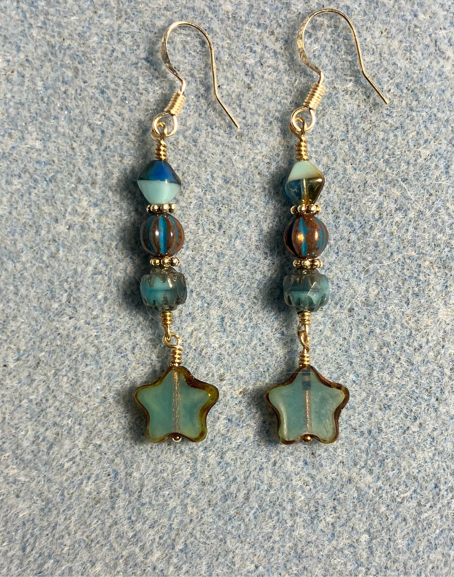 Small light turquoise Czech glass star bead earrings adorned with turquoise and tan Czech glass beads.