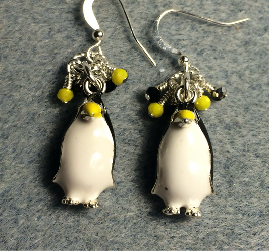 Black, white, and yellow enamel penguin charm earrings adorned with tiny dangling black and yellow Chinese crystal beads.