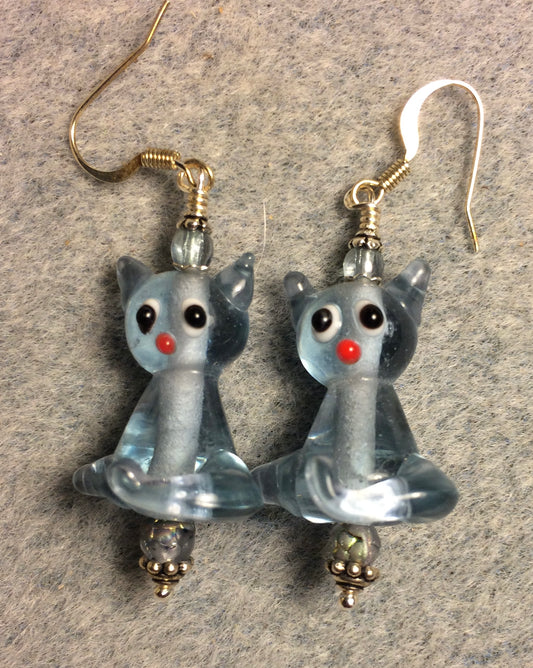 Translucent light blue lamp work cat bead earrings adorned with light blue Czech glass beads.