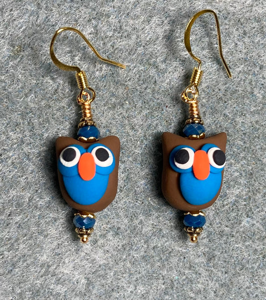 Brown, blue, and orange polymer clay bird bead earrings adorned with blue Chinese crystal beads.