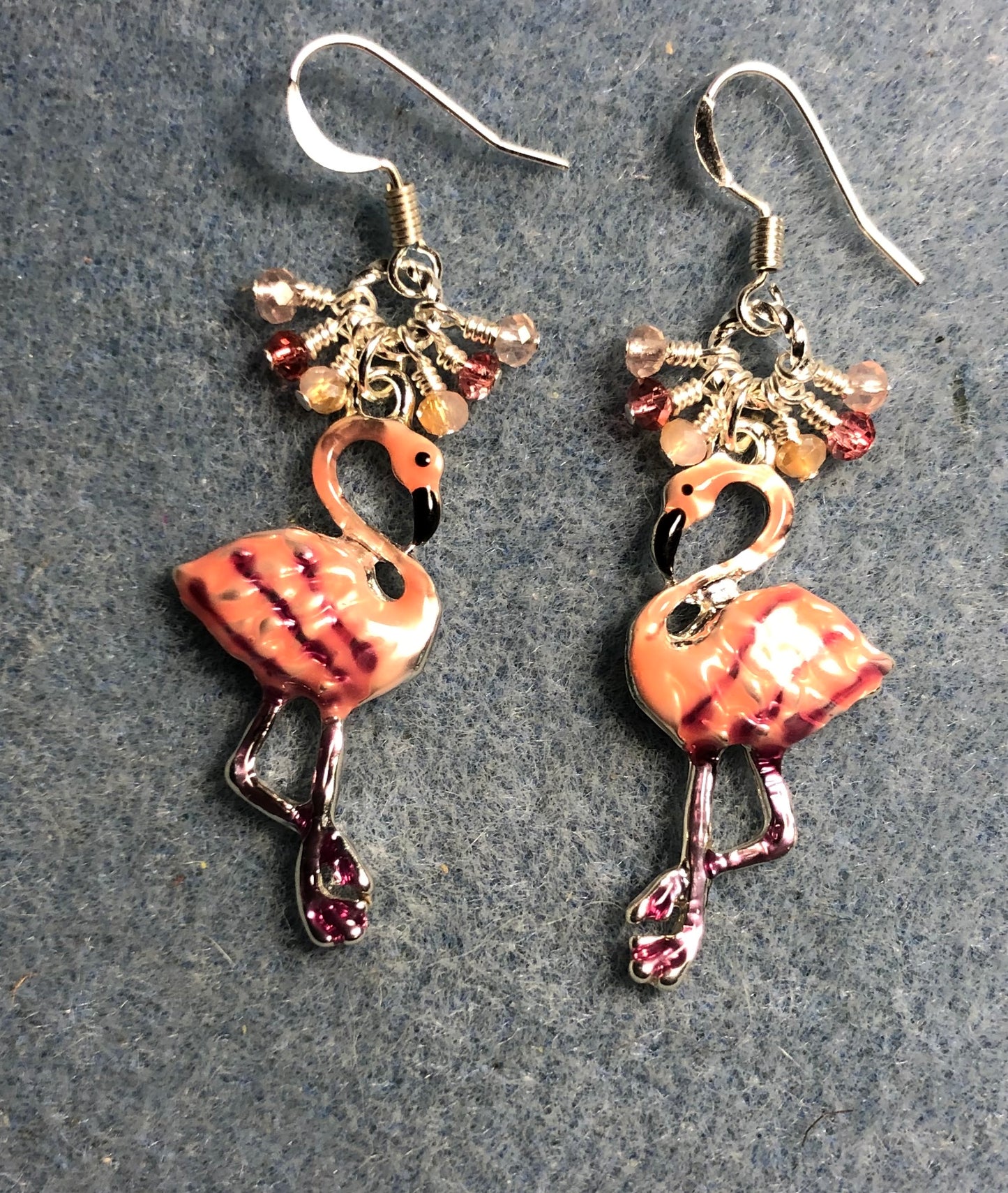 Pink and peach enamel flamingo charm earrings adorned with tiny dangling pink, rose, and peach Chinese crystal beads.