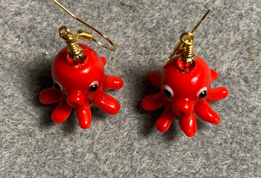 Red lamp work octopus bead earrings adorned with red Chinese crystal beads.
