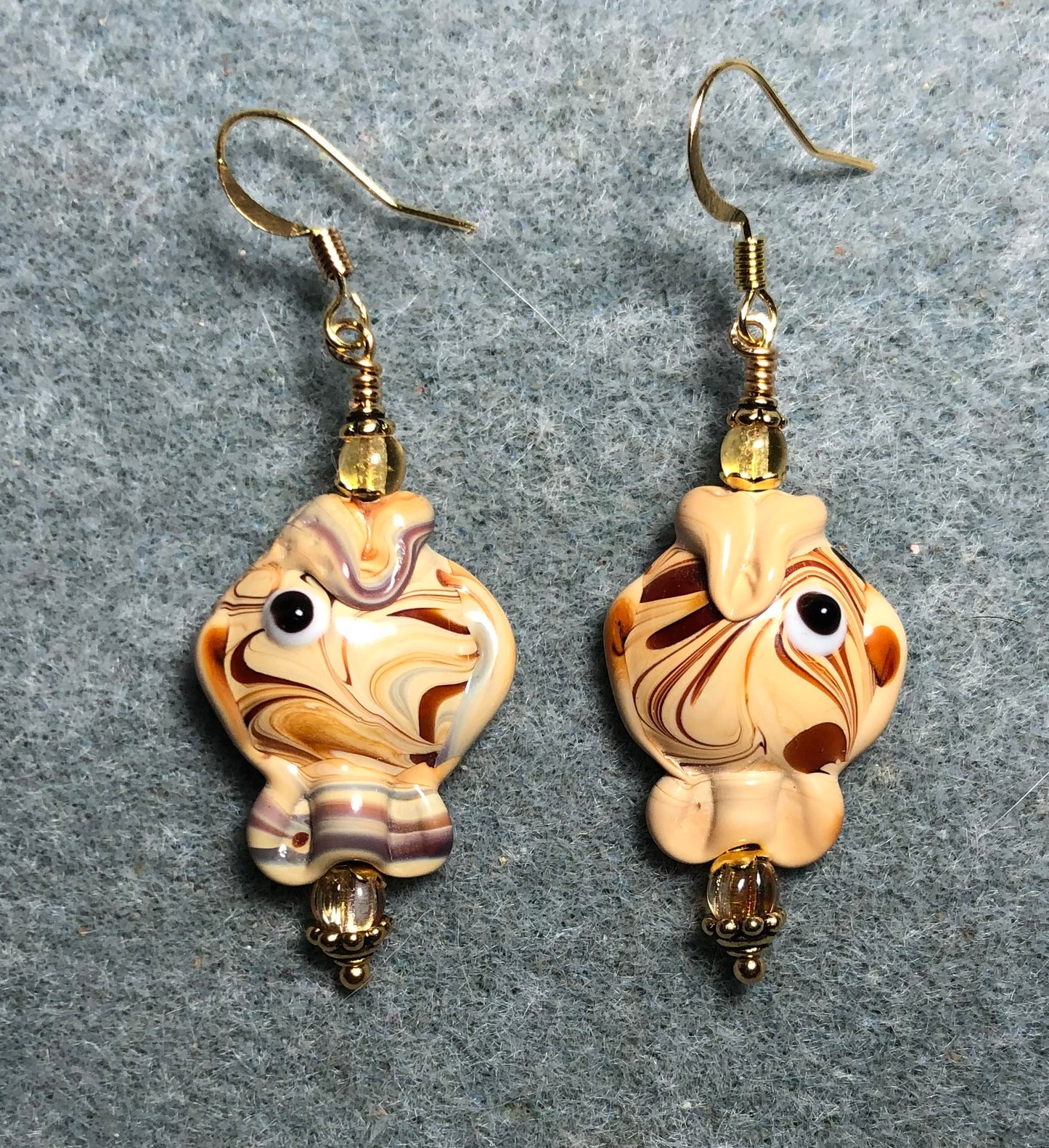 Tan lamp work bead earrings adorned with tan Czech glass beads.