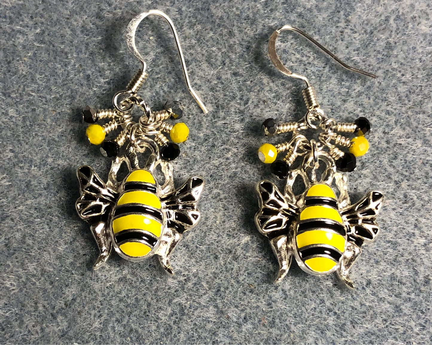 Yellow and black enamel striped honeybee charm earrings adorned with tiny dangling yellow and black Chinese crystal beads.