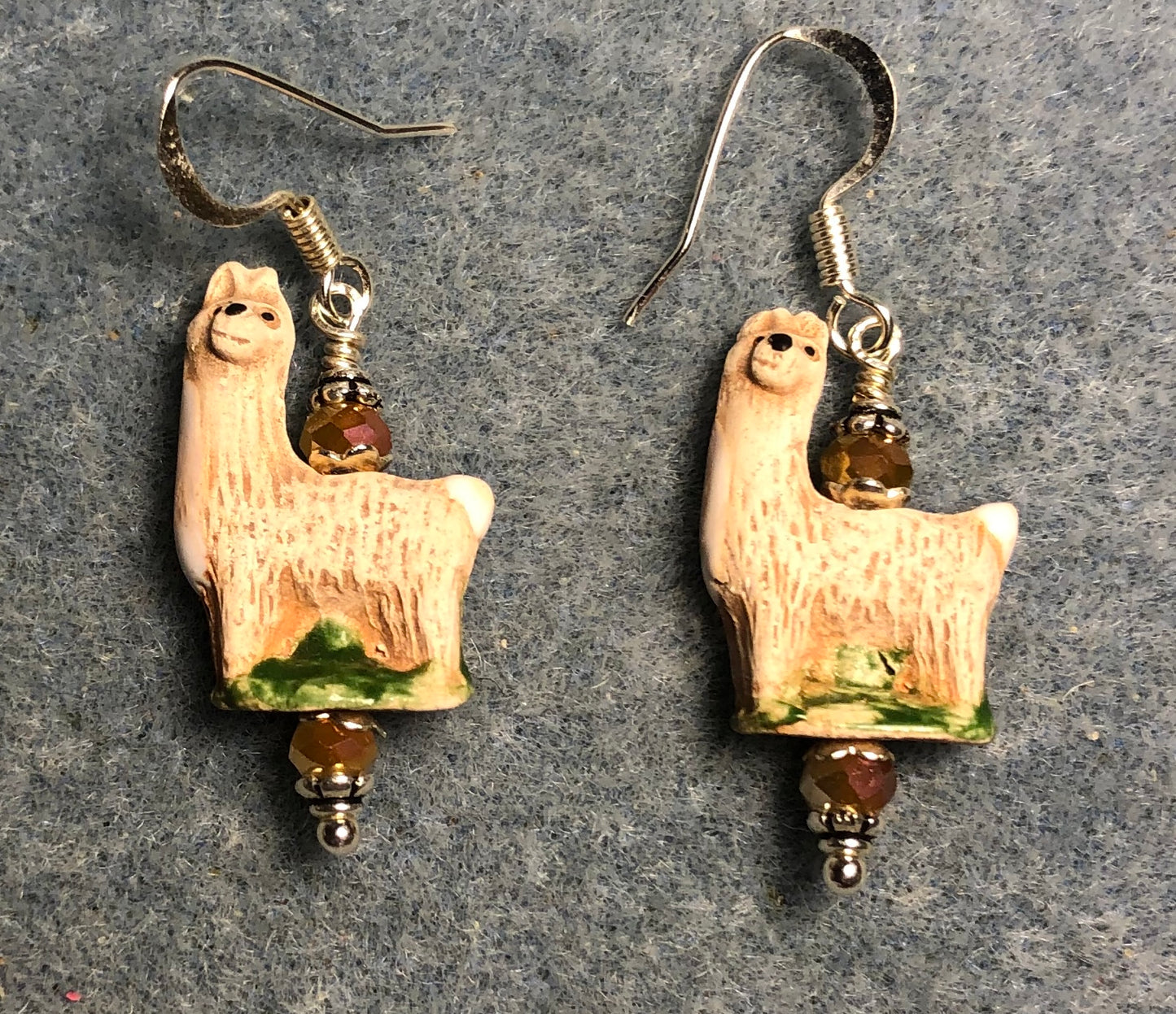 Small tan ceramic llama bead earrings adorned with tan Chinese crystal beads.