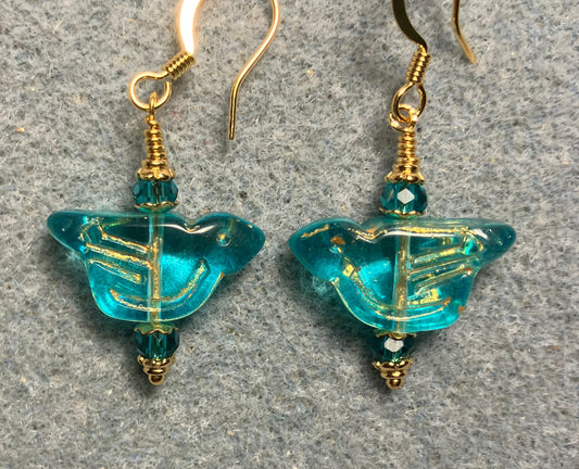 Translucent turquoise (with gold wash) Czech glass bird bead earrings adorned with turquoise Chinese crystal beads.