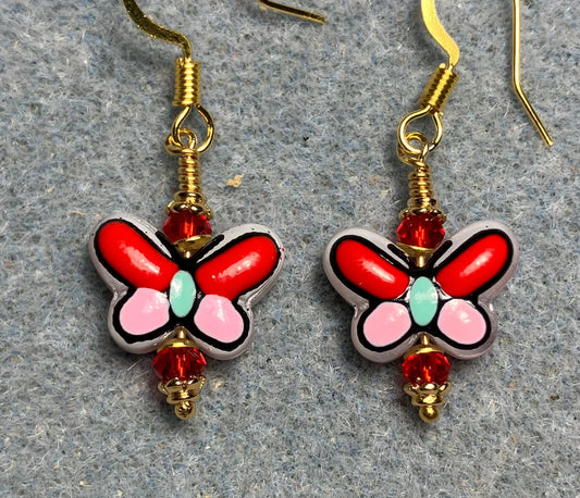 Small red, pink, and aqua ceramic butterfly bead earrings adorned with red Chinese crystal beads.