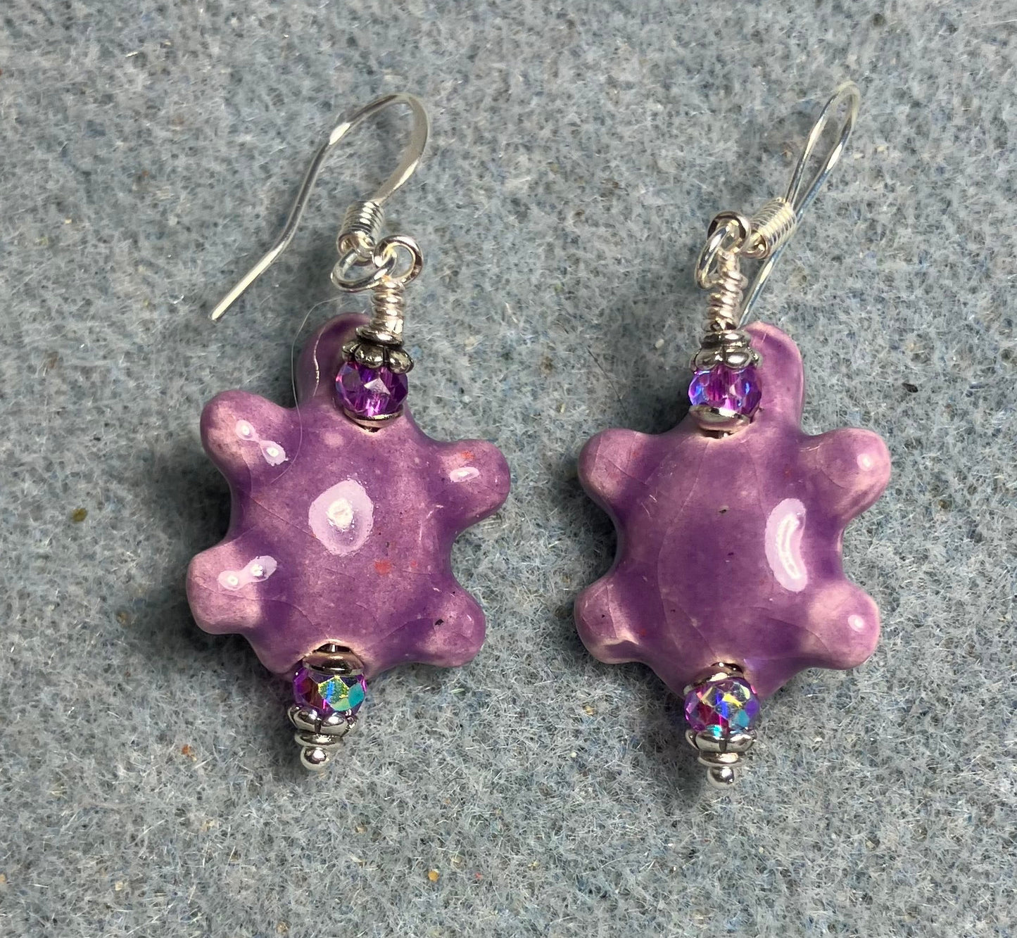 Purple ceramic turtle bead earrings adorned with purple Chinese crystal beads.